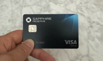 Nomadic Matt holding a Chase Sapphire Reserve credit card