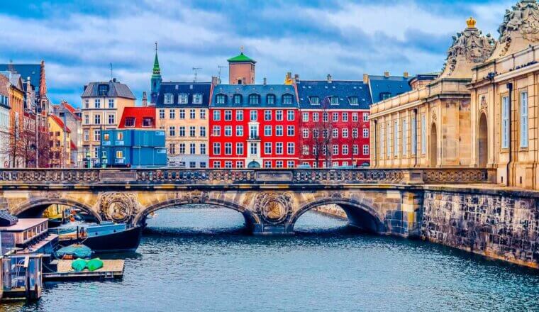 The colorful buildings of central Copenhagen, Denmark along the canal in the summer