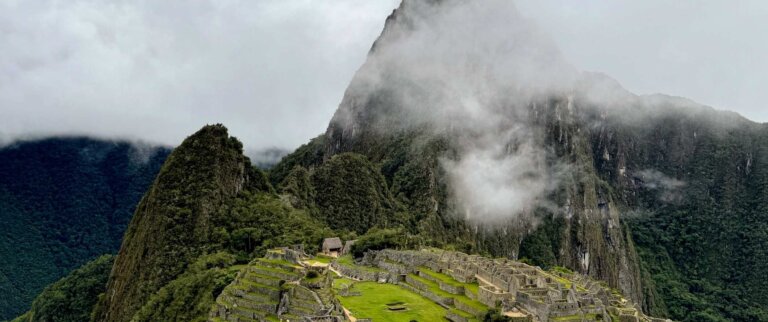 Iconic image of Machu Picchu as seen through the clouds